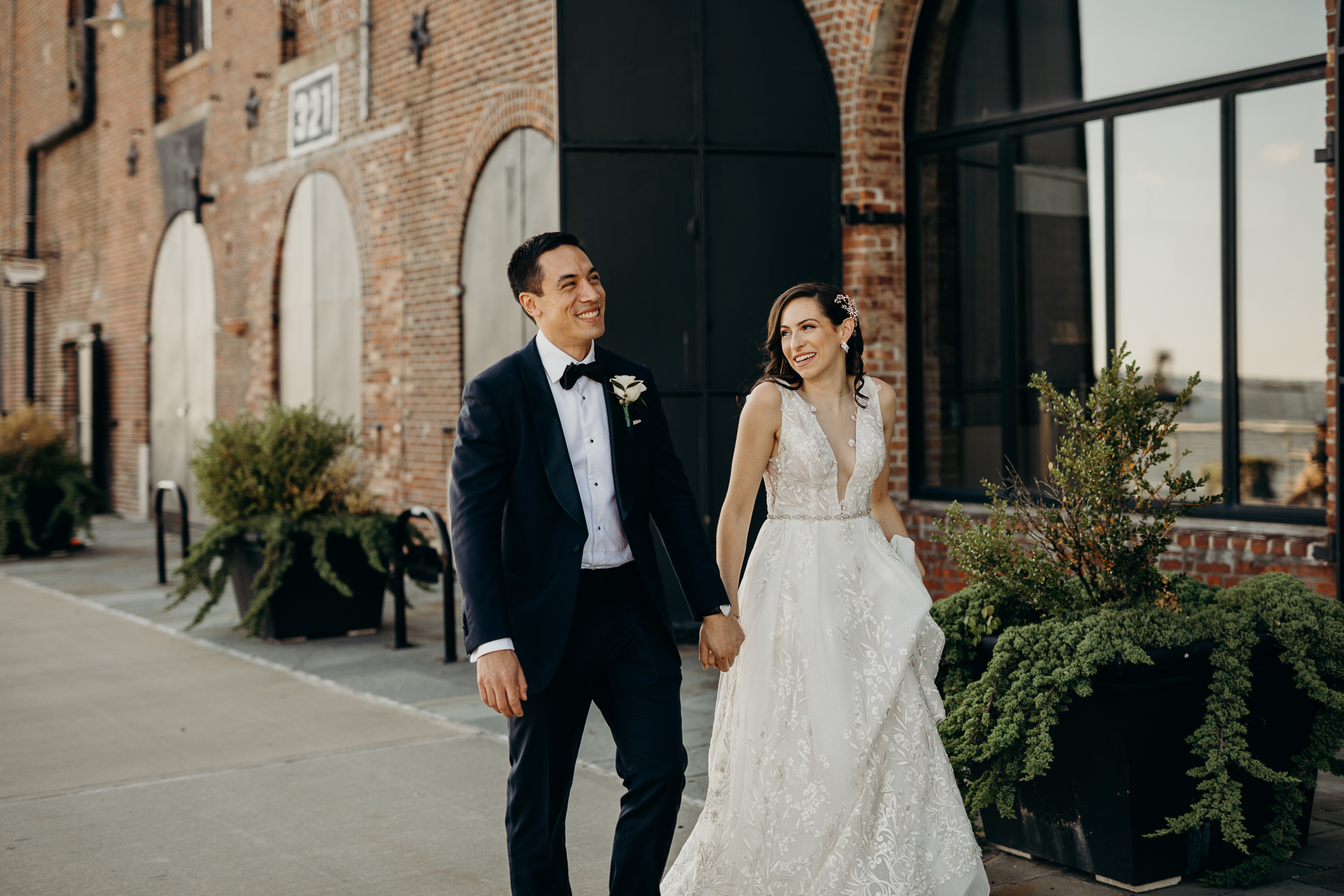 a portrait of a bride and groom on their wedding day at liberty warehouse in brooklyn, new york city