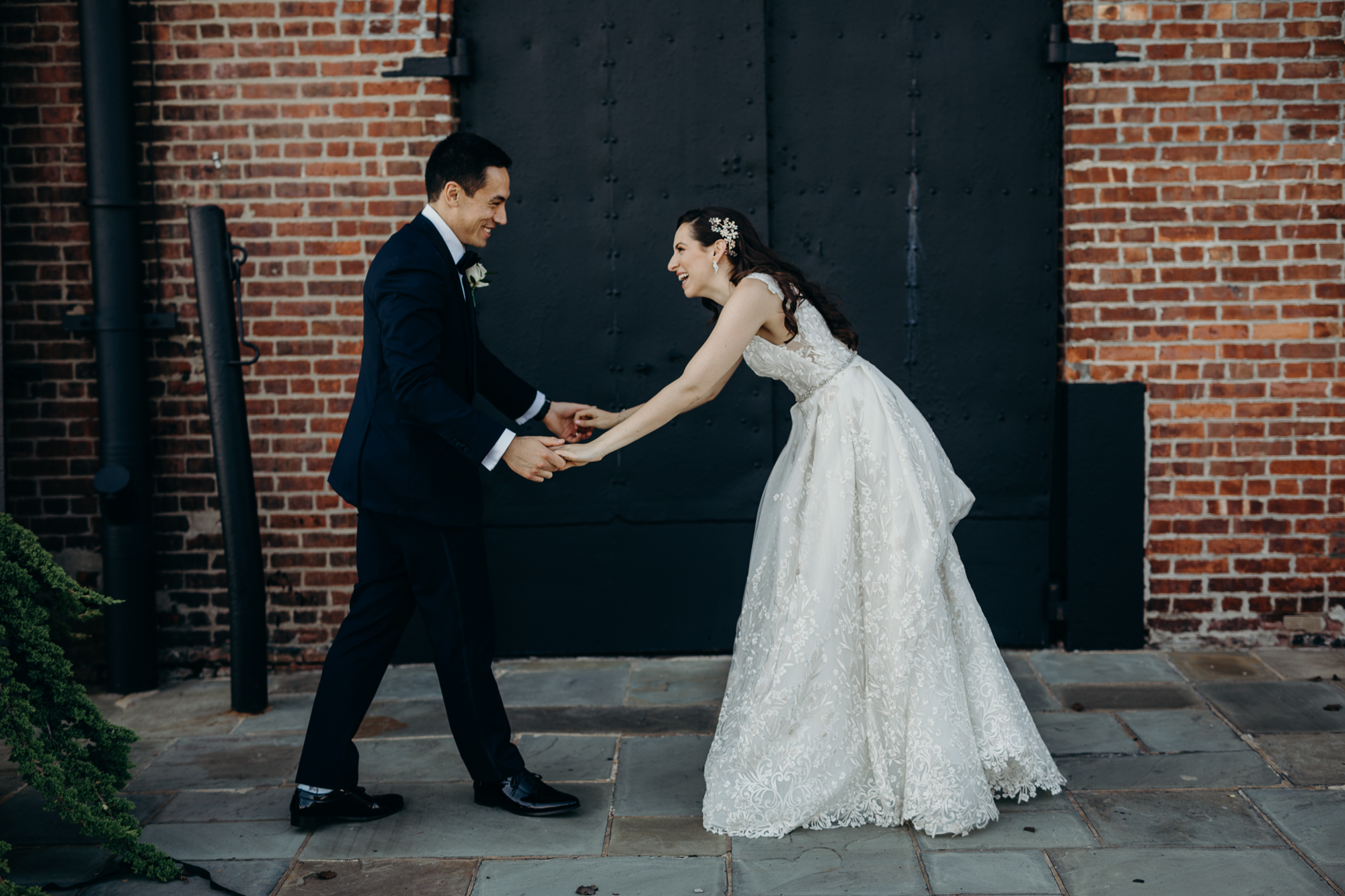 a portrait of a bride and groom on their wedding day at liberty warehouse in brooklyn, new york city