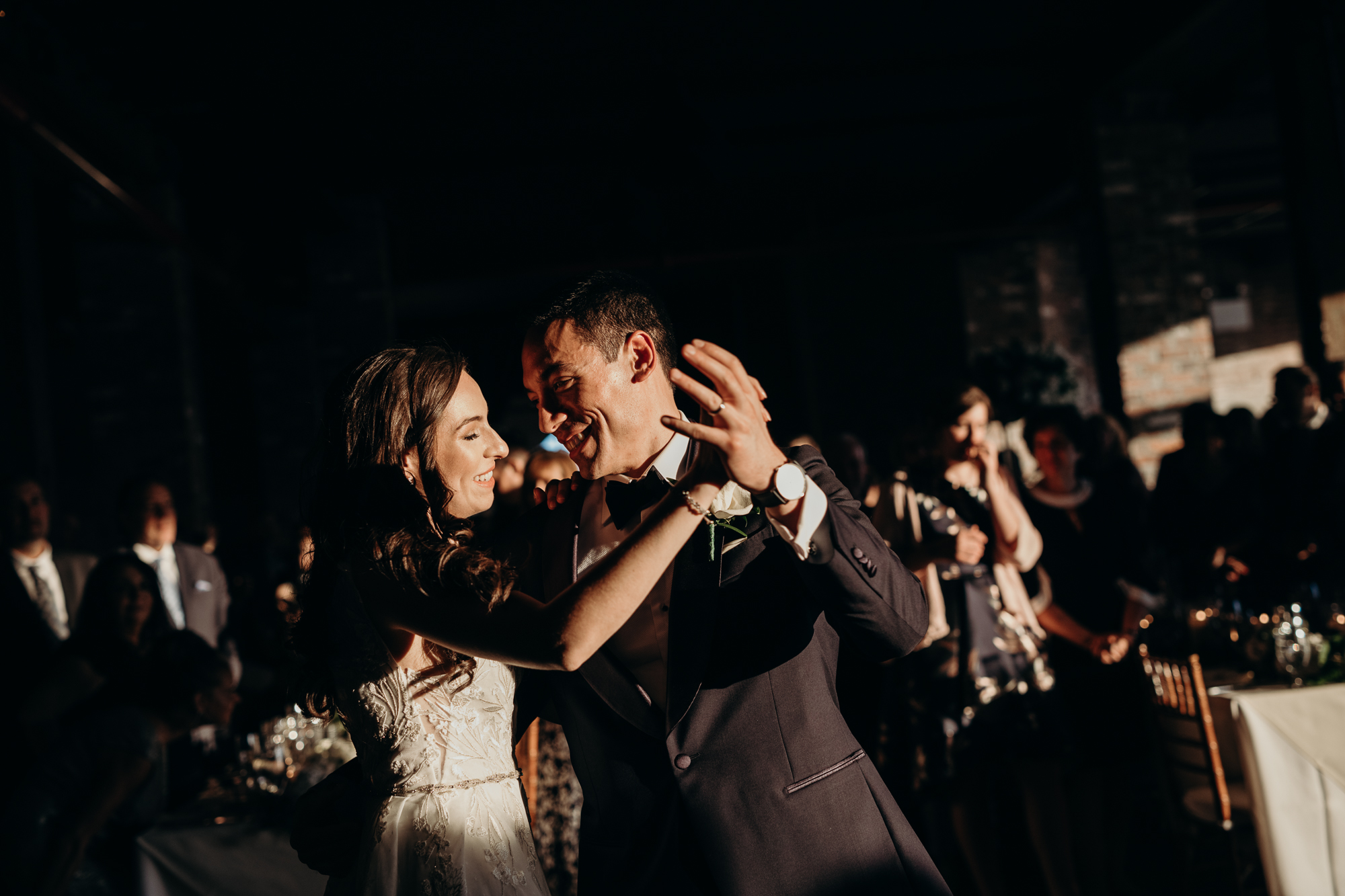 a bride and groom during their first dance at liberty warehouse in brooklyn, new york city