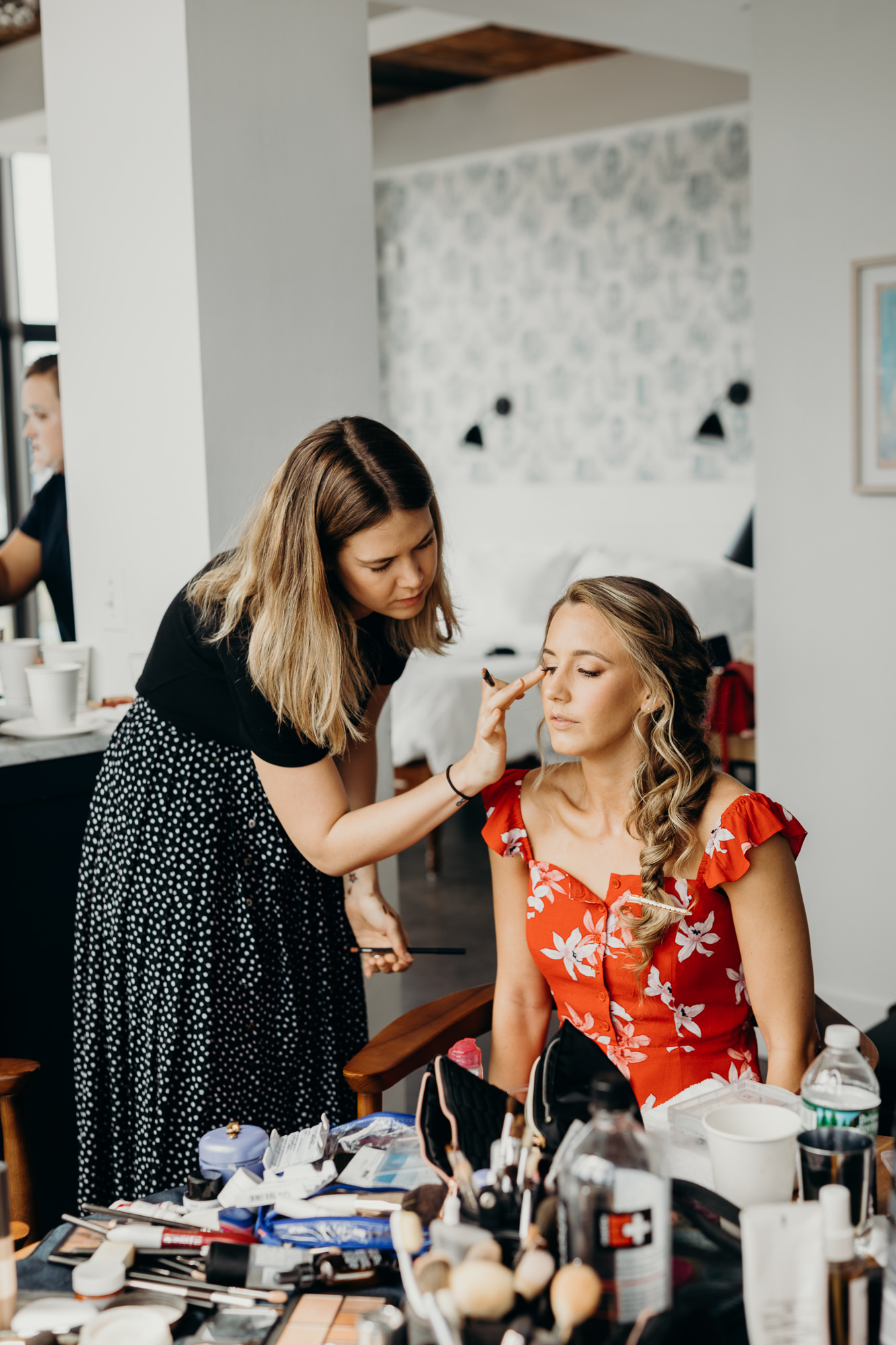 a bride having makeup done at the wythe hotel in brooklyn, new york city