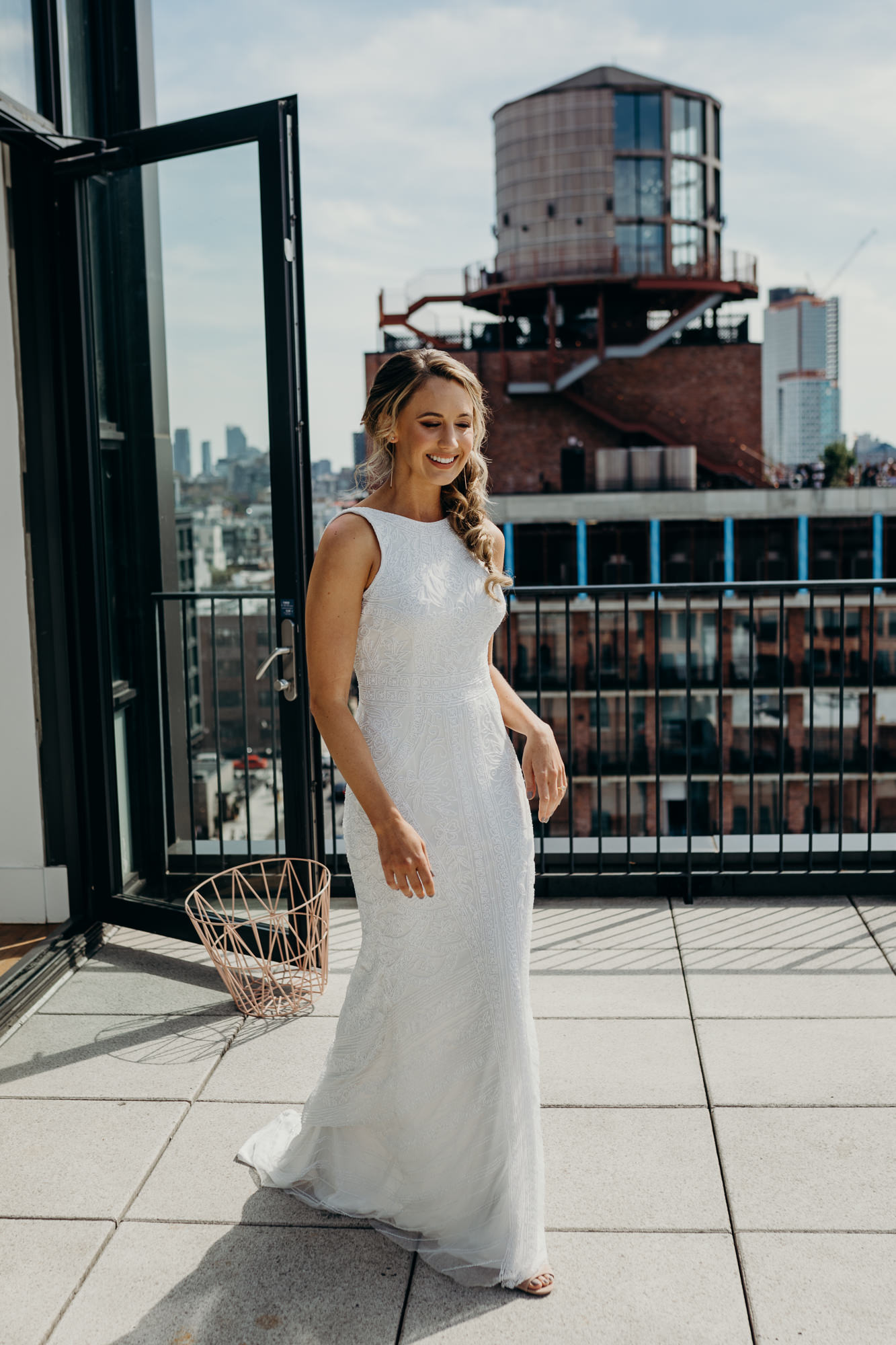 a bride approaches her groom for their first look at the wythe hotel in brooklyn, new york city