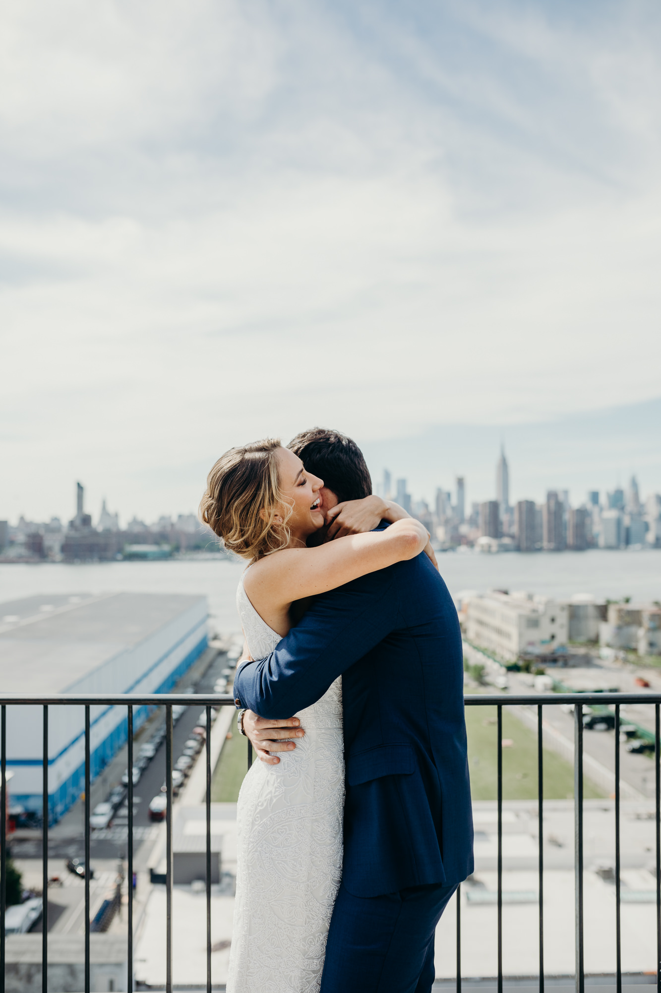 a bride and groom hug on theirw wedding day at the wythe hotel in brooklyn, new york city