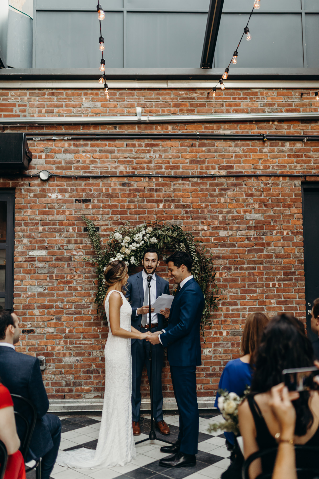 a wedding ceremony at the wythe hotel in brooklyn, new york city