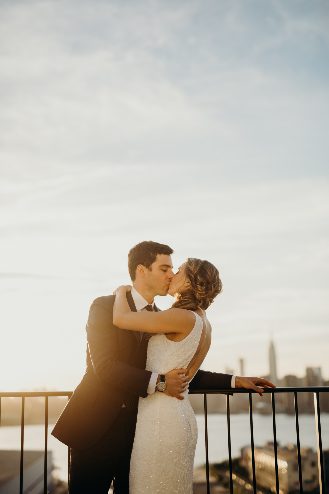 a portrait of a bride and groom during sunset at the wythe hotel in brooklyn, new york city