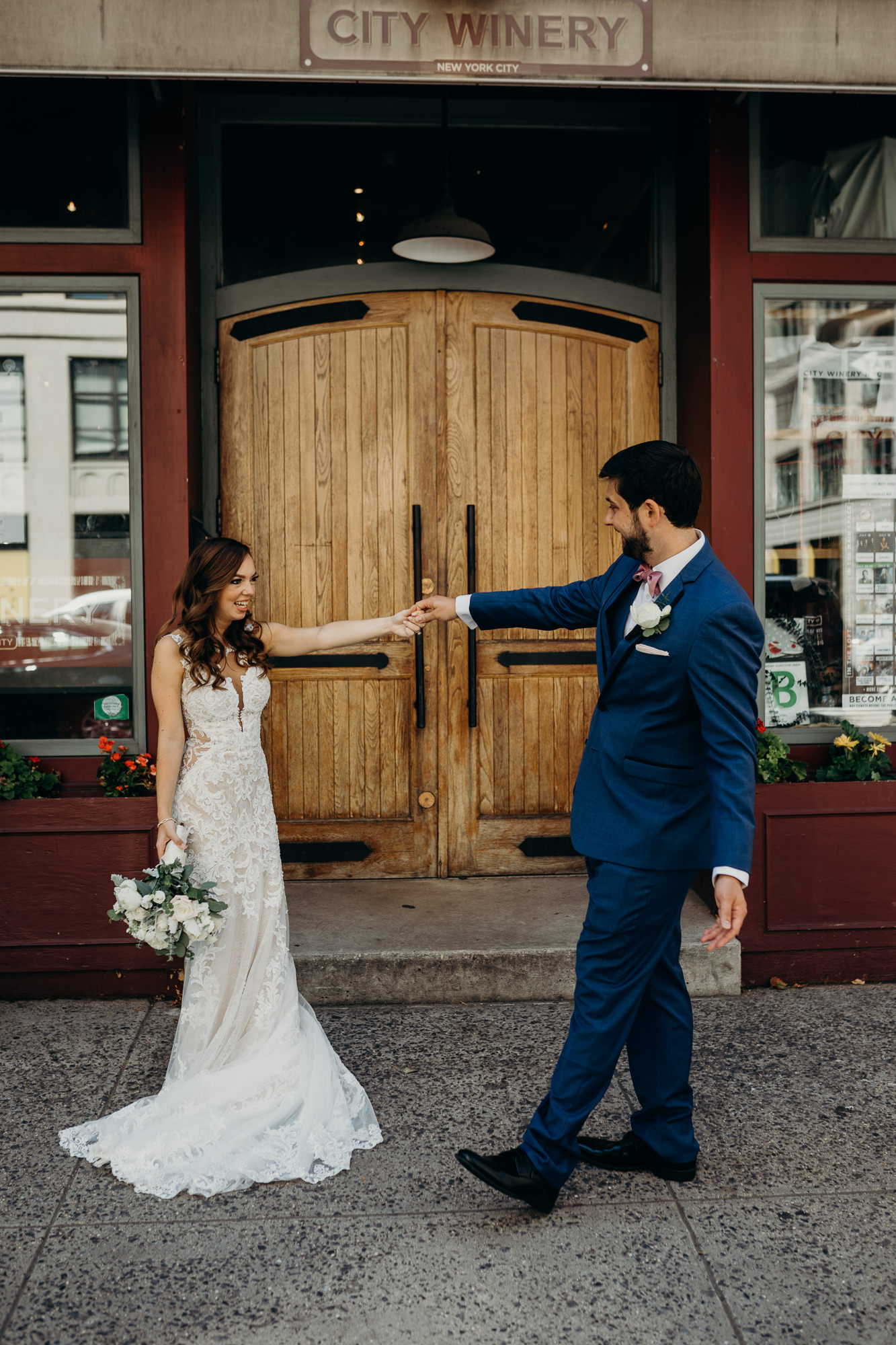 a bride and groom during their first look at city winery in new york city