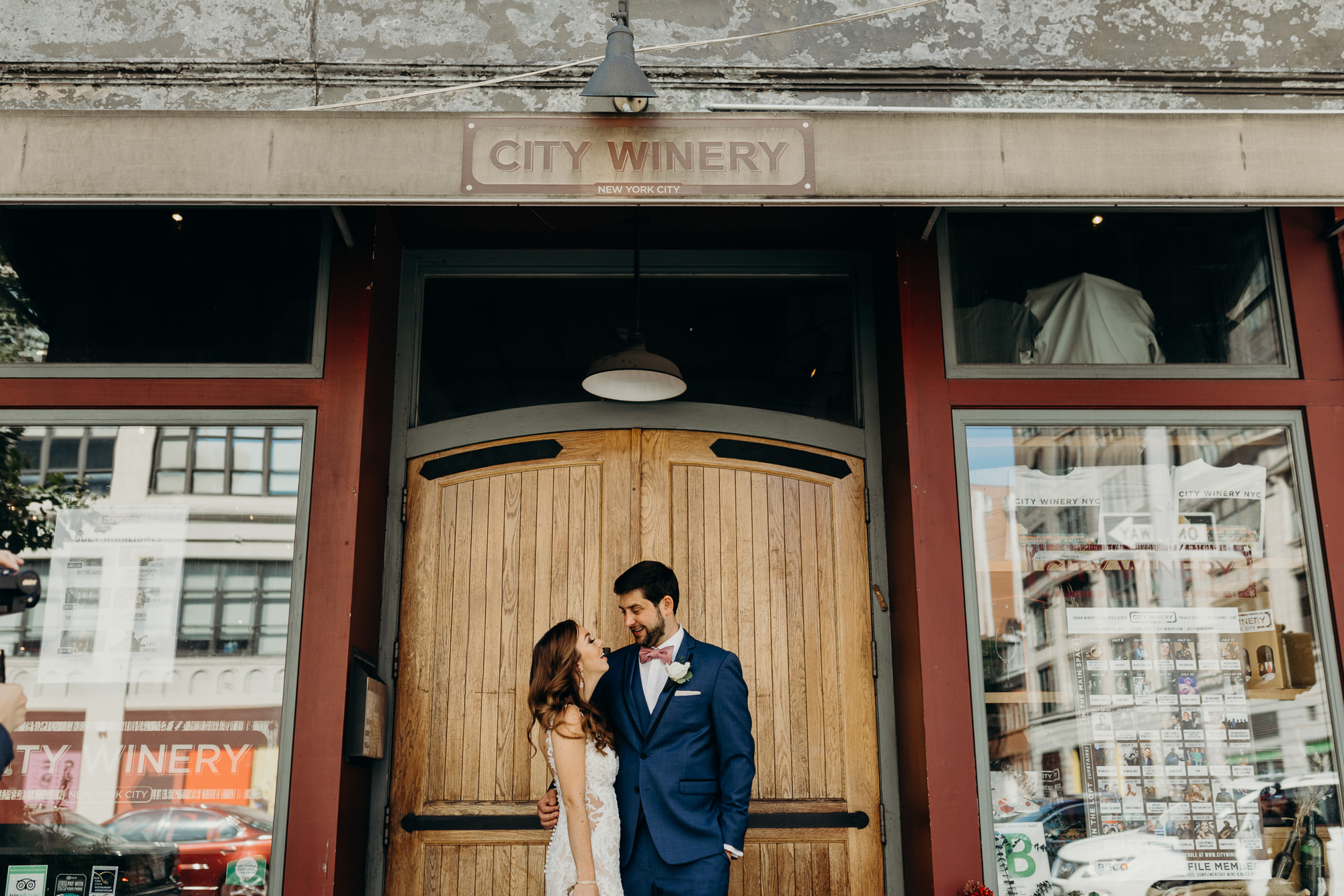 a bride and groom during their first look at city winery in new york city