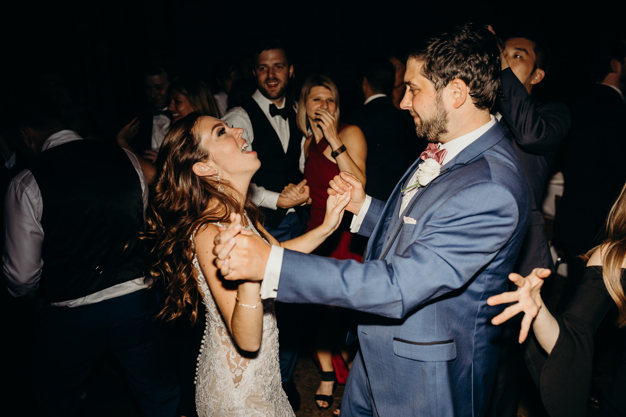a bride and groom dance during their wedding reception at city winery in new york city, new york