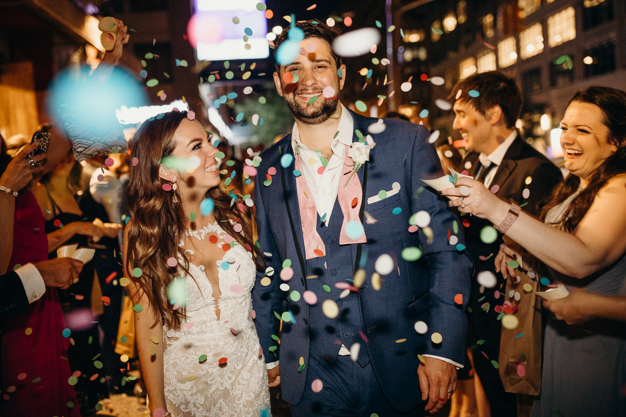 a bride and groom during their confetti exit at their wedding reception at city winery in new york city, new york