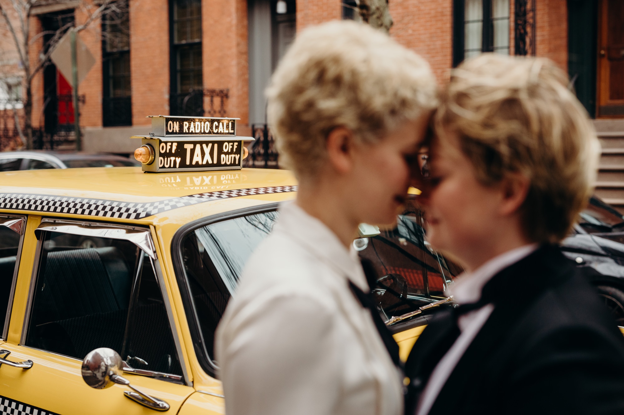 a portrait of a wedding couple in a vintage cab in new york city, new york