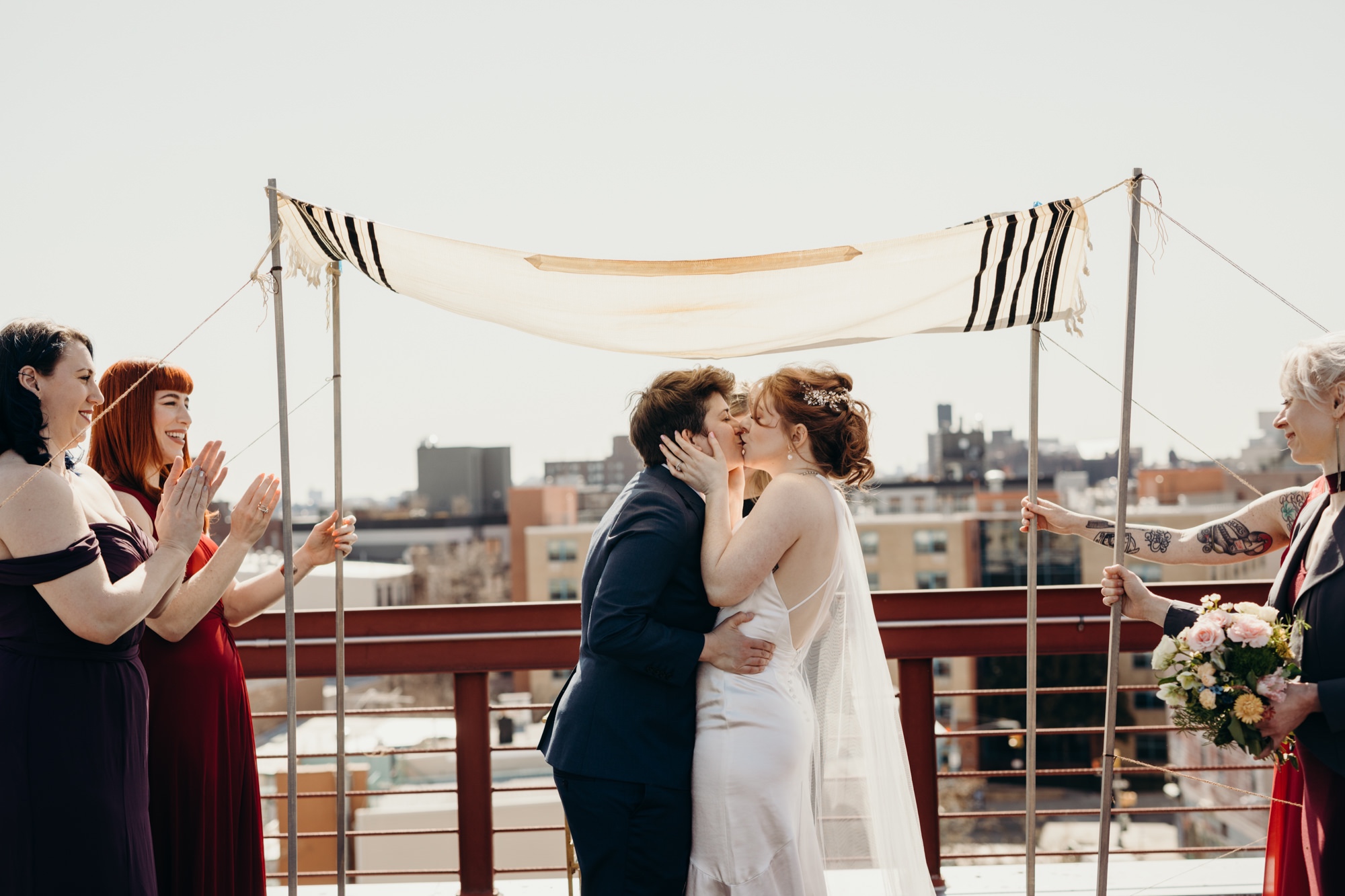 a couple celebrating after their wedding ceremony in bushwick, brooklyn