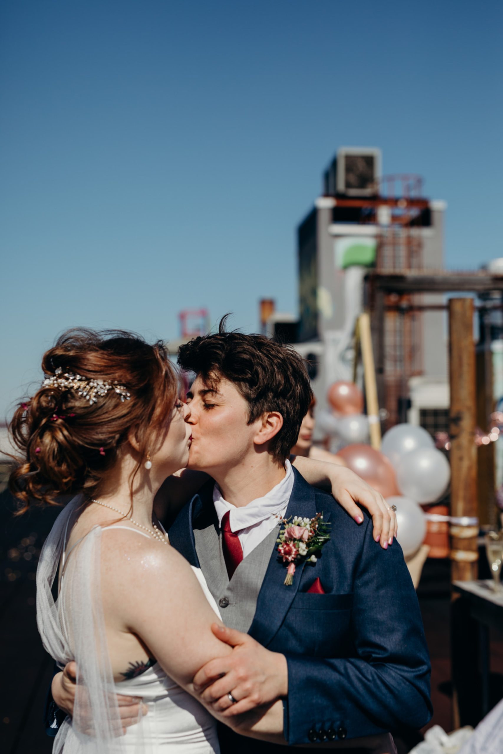 a couple during their first dance on a rooftop in bushwick, brooklyn