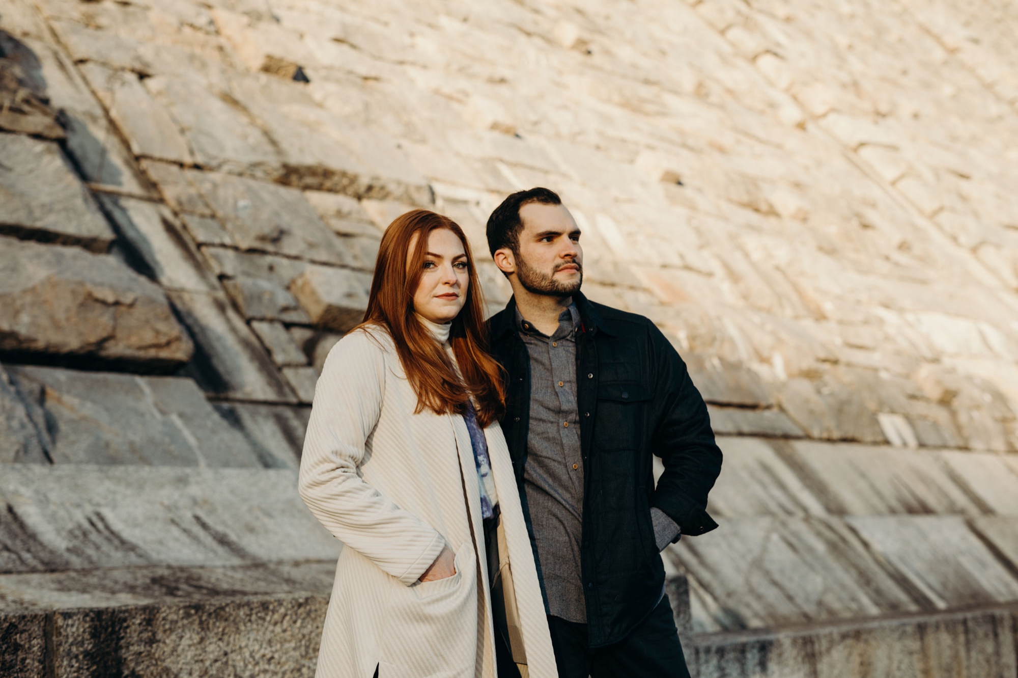 a engagement portrait of a couple at the kensico dam in white plains, new york
