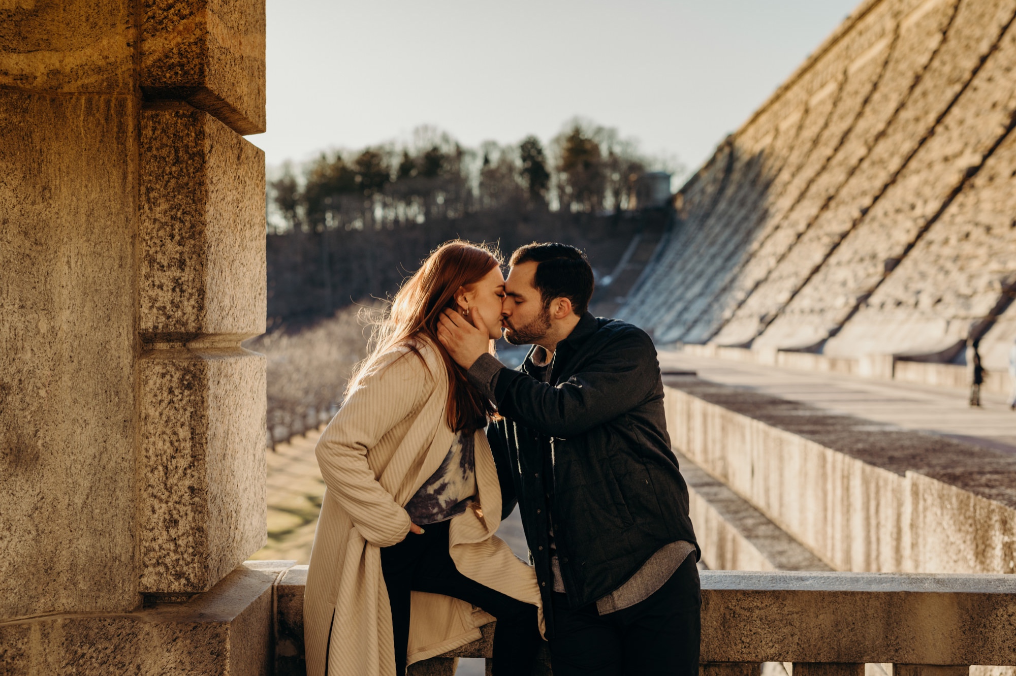 a engagement portrait of a couple at the kensico dam in white plains, new york