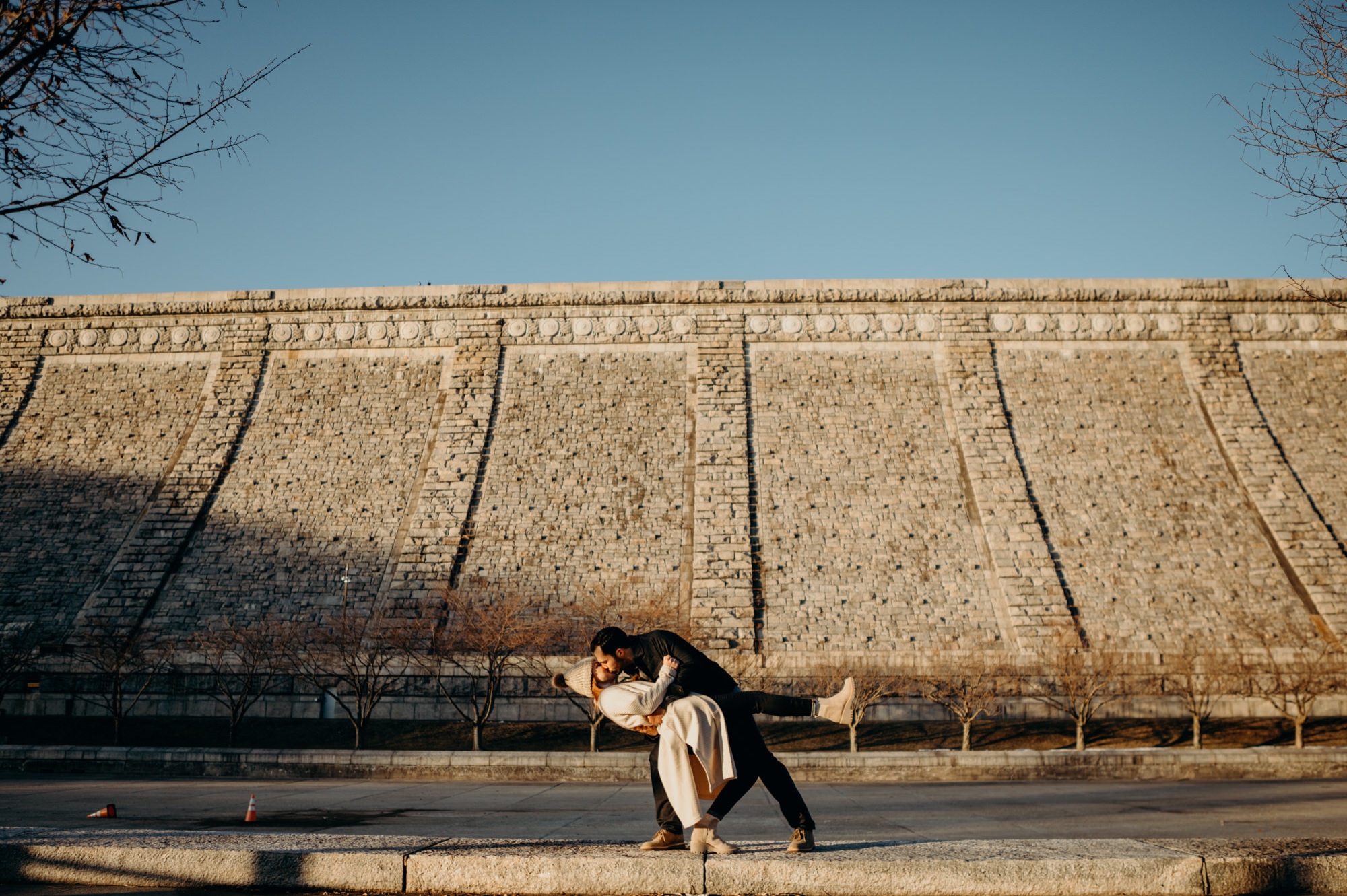 a engagement portrait of a couple dipping at the kensico dam in white plains, new york