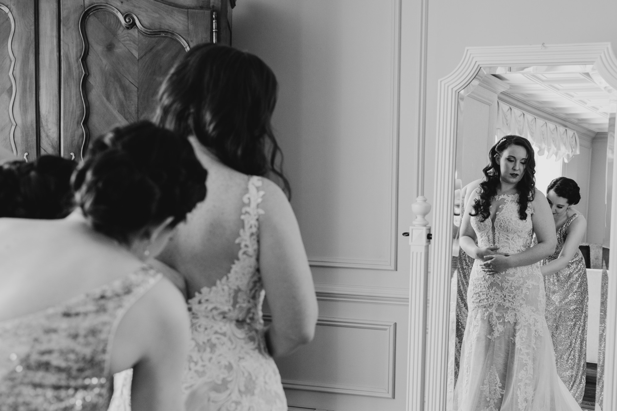 bride getting into her wedding dress at valley regency in new jersey