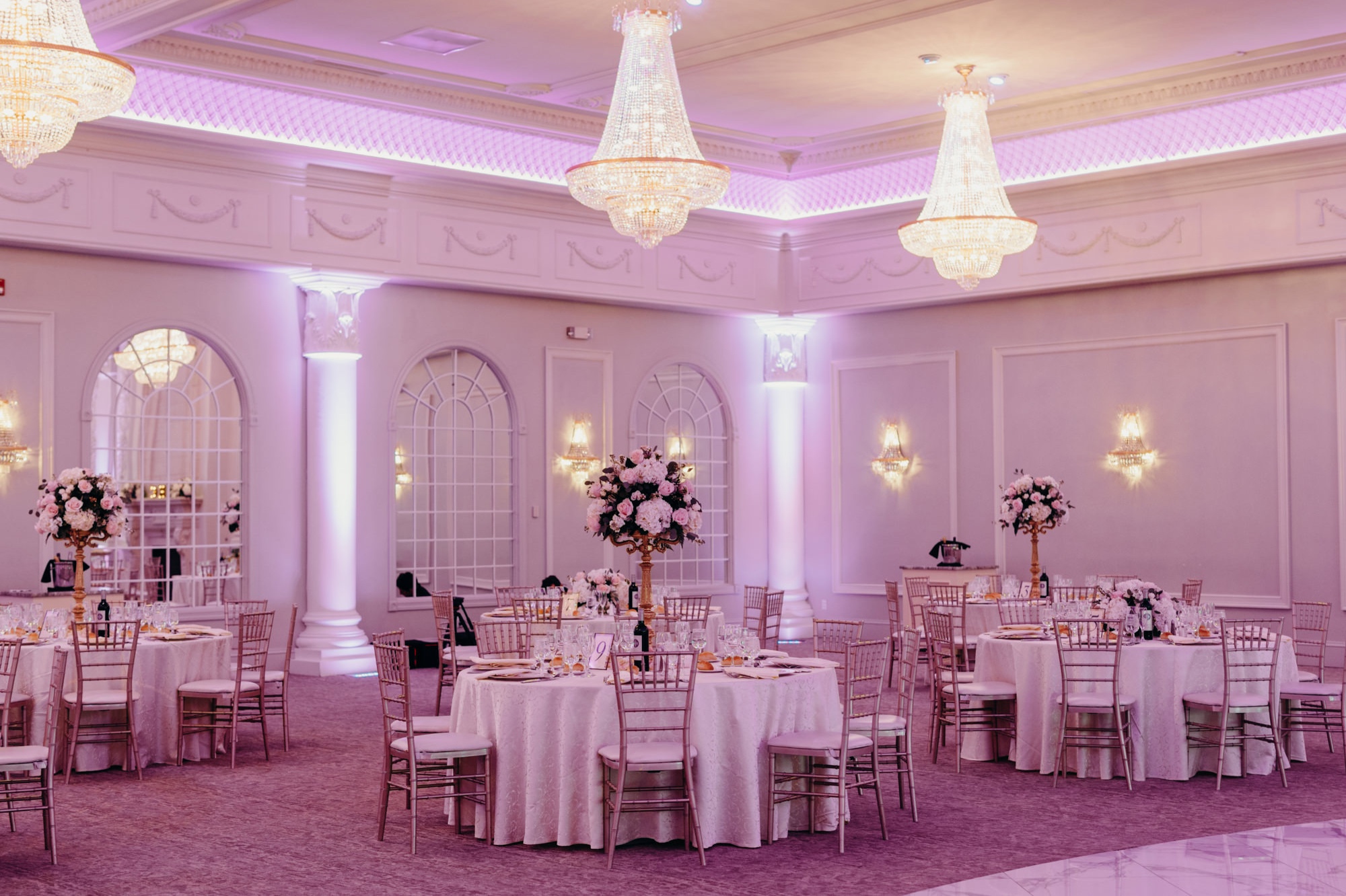 wedding table and reception room decor, a tall centerpiece of flowers at valley regency in new jersey