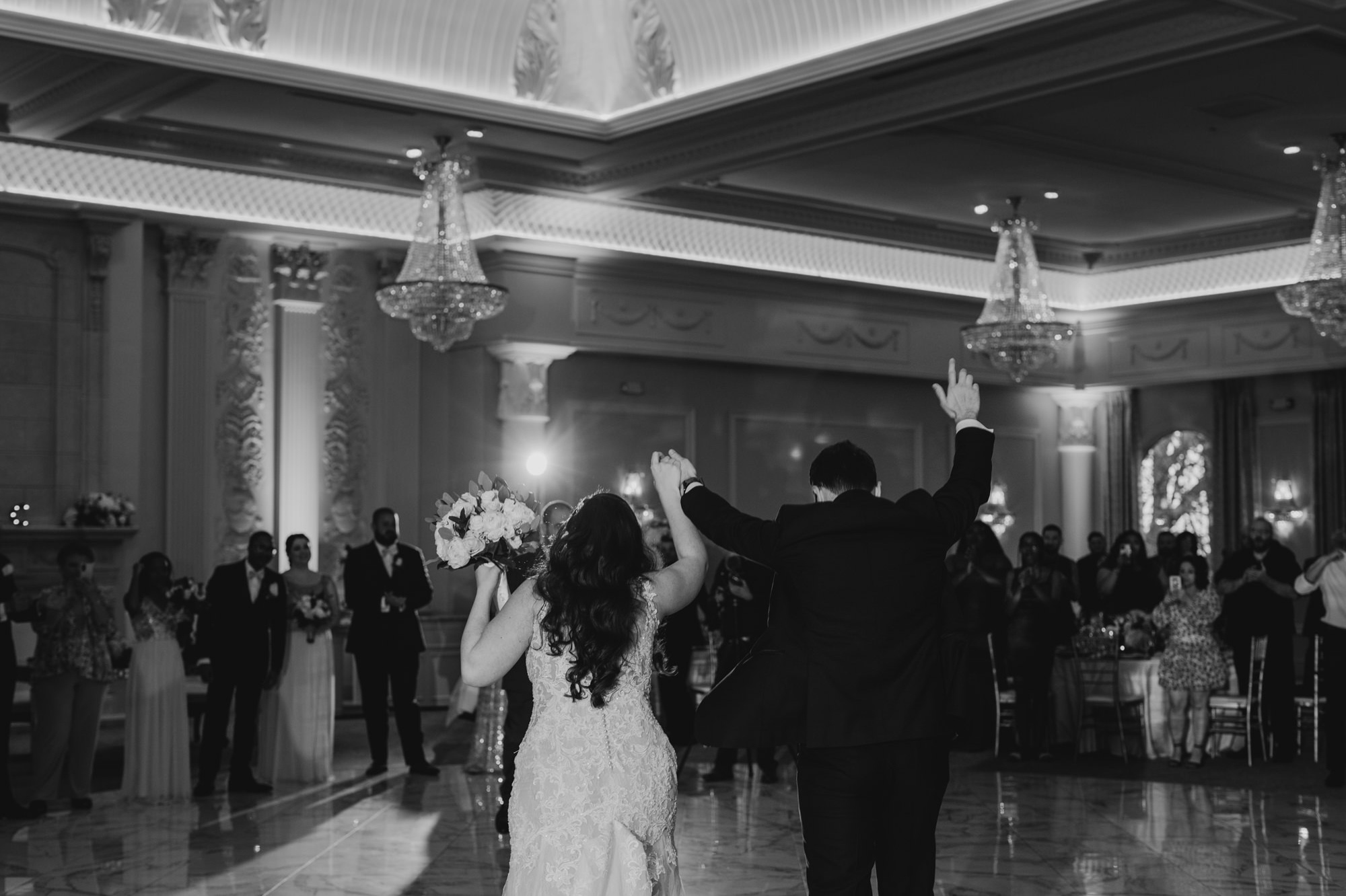 bride and groom enter their reception at valley regency in new jersey