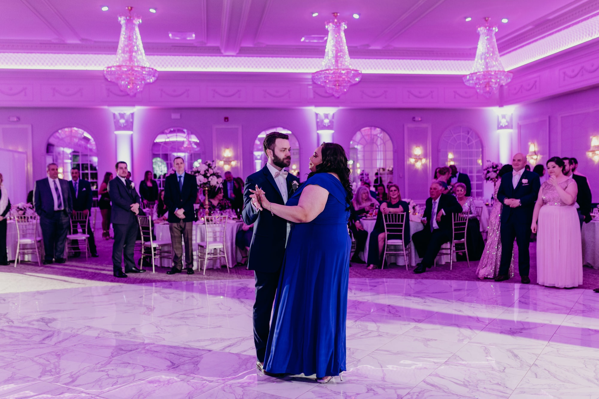 groom and his sister dance during a wedding reception at valley regency in new jersey