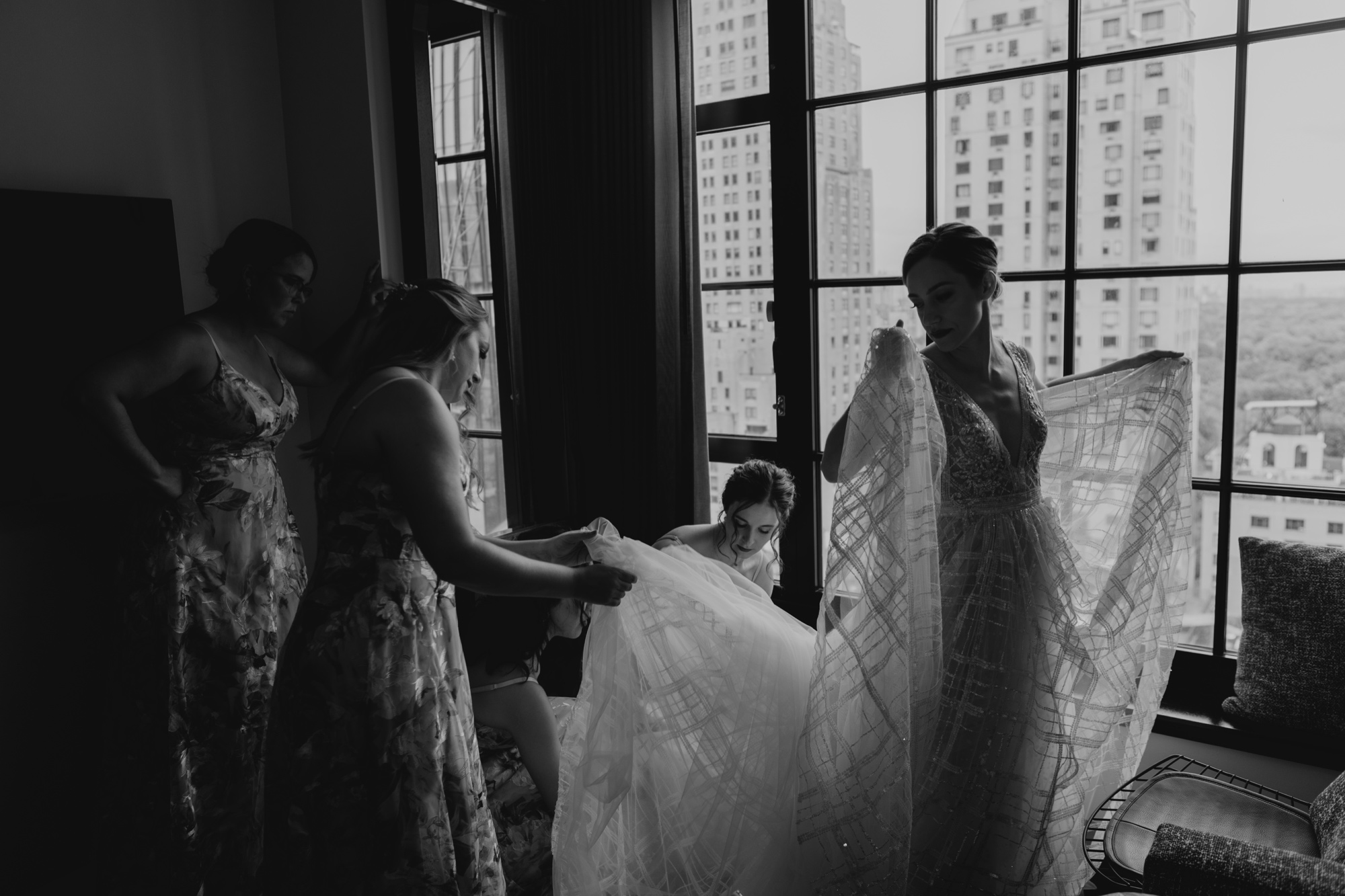 bride getting into her wedding dress at at le parker meridien in new york city