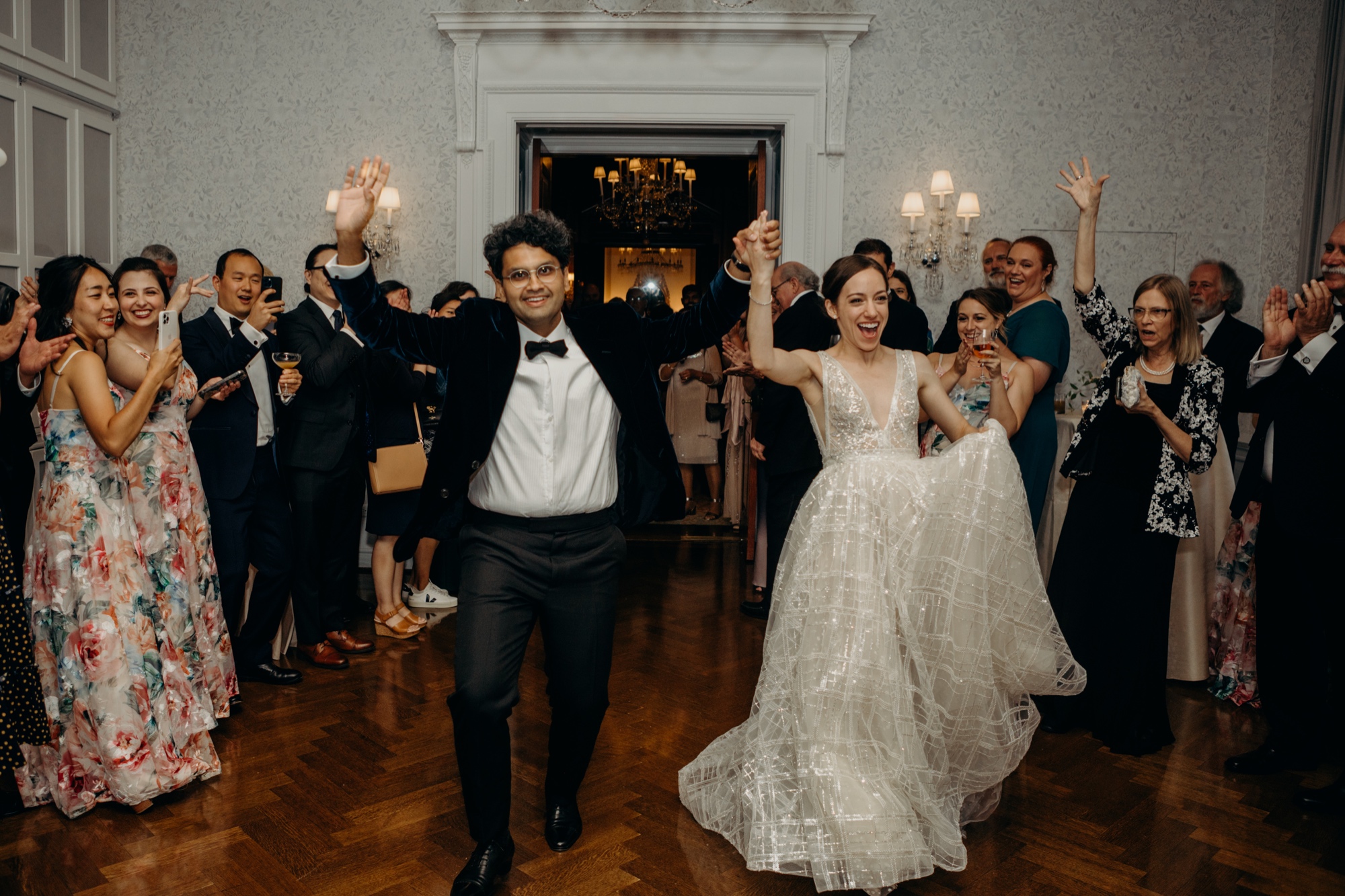 bride and groom enter their dance floor during their wedding reception at harold pratt house