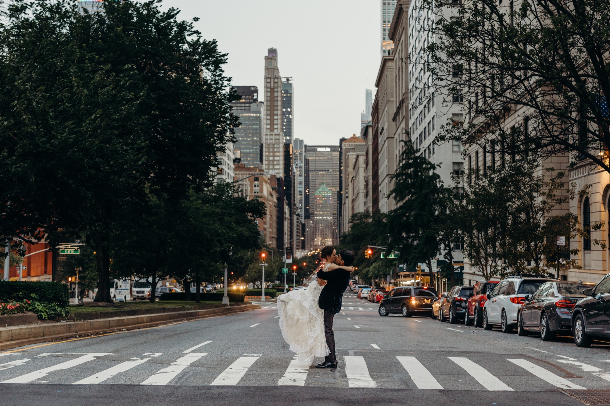 bride and groom hugging in the middle of the street in new york city