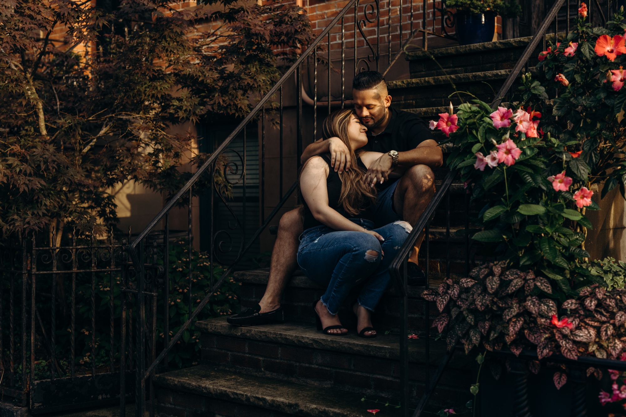 image of a couple cuddling on a brownstone stoop