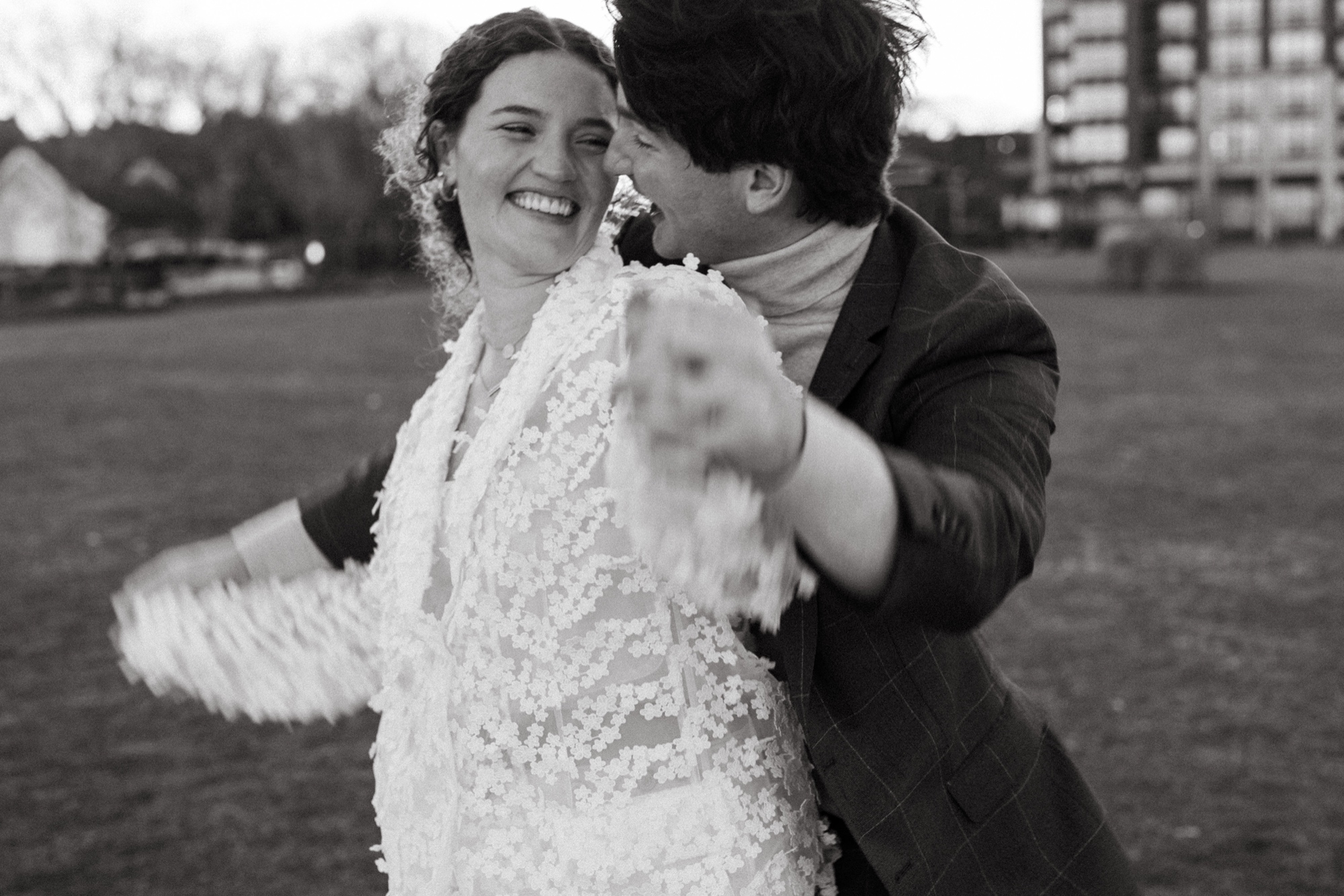 a black and white photo of a couple playing in hoboken, new jersey